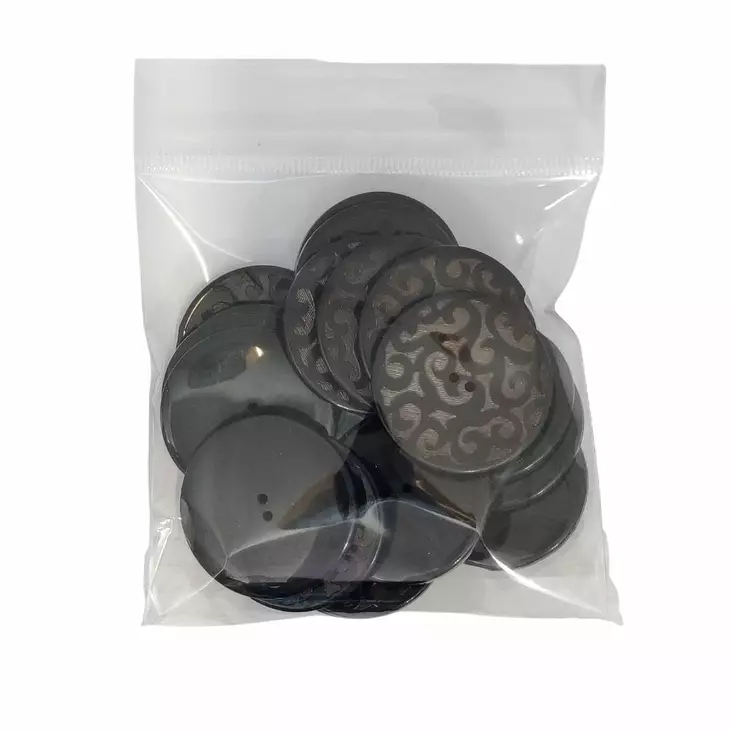MUOVINEN 2-REIKÄ NAPPI 38 MM MUSTA/RUSKEA KUVIO 1PUSSI (N. 10 KPL) N4724-38 - Koristenapit - 36669 - 1
